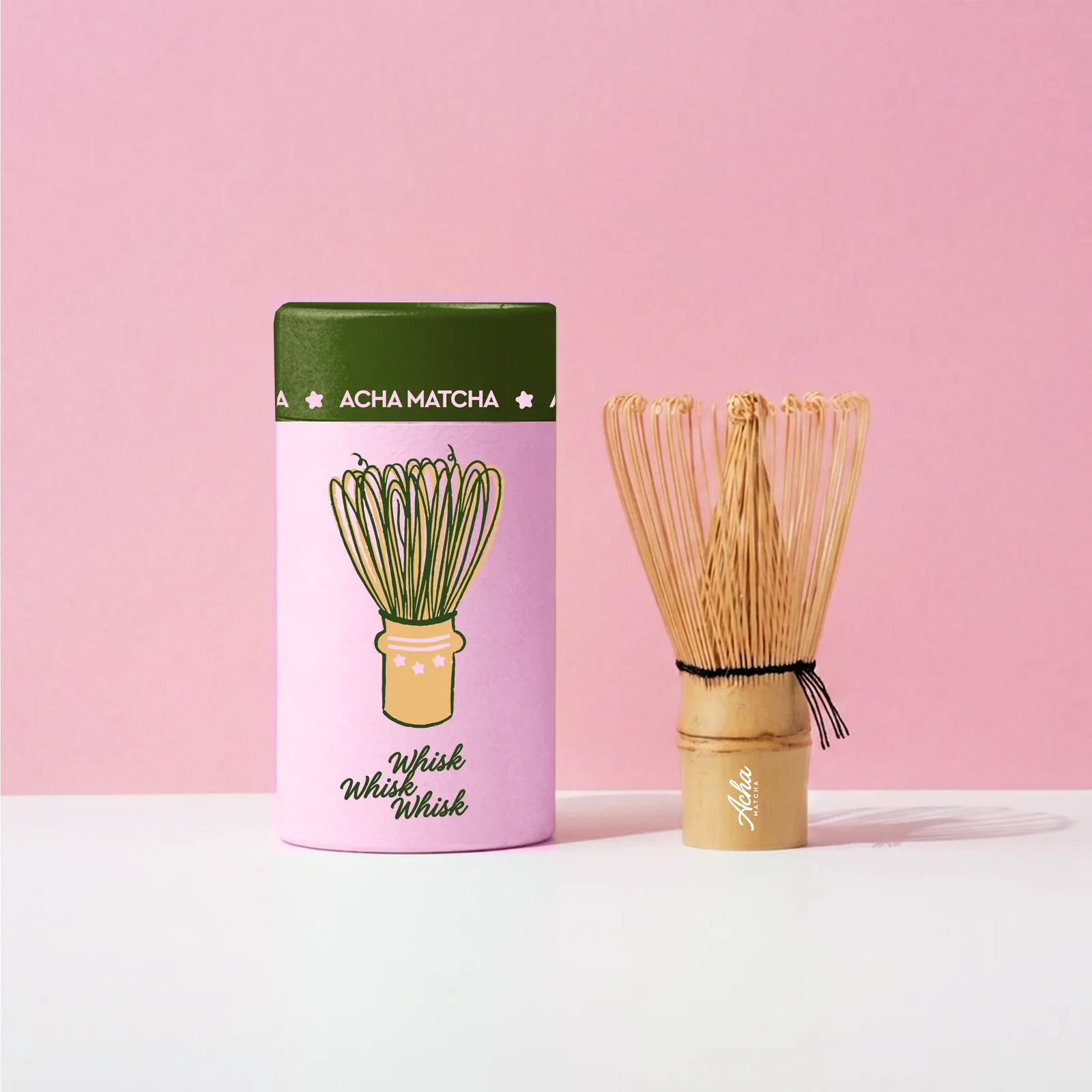 The Acha Matcha whisk tube beside a bamboo chasen